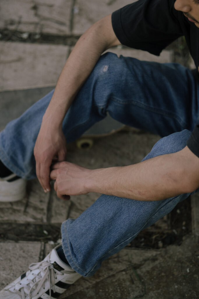 a man setting down