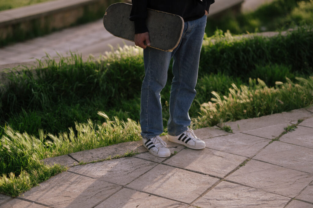 a skater holding a skateborad