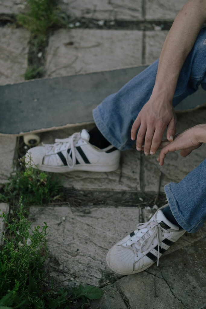 a man setting down