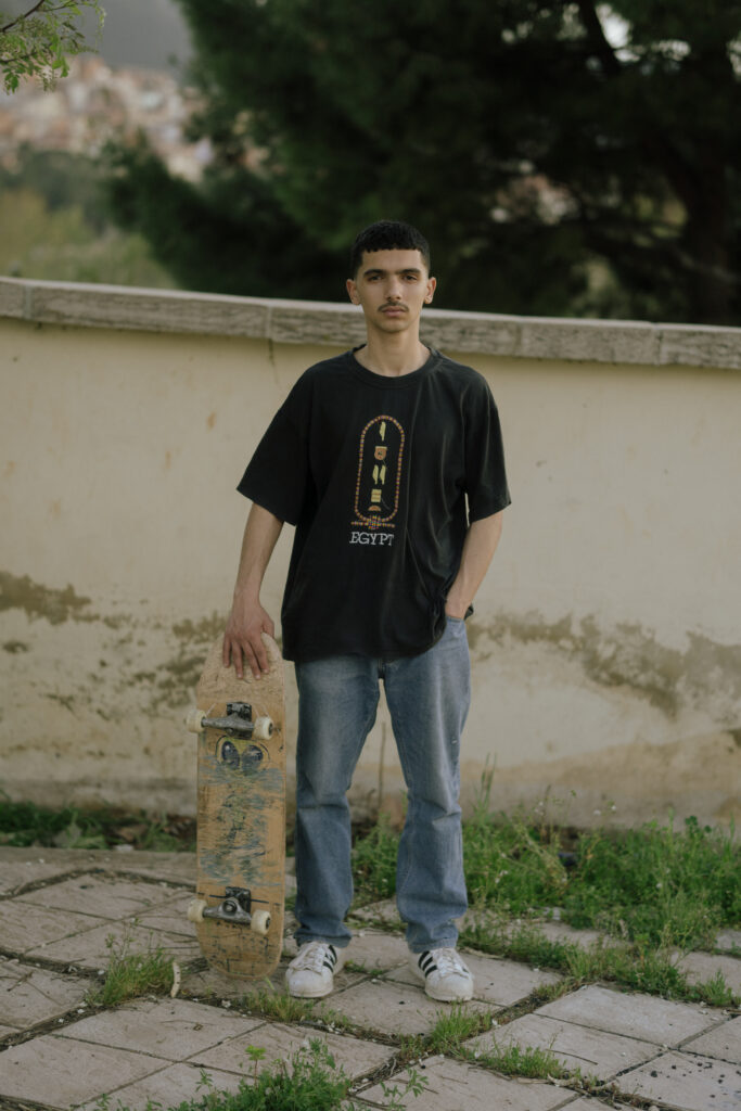a man standing with his skate
